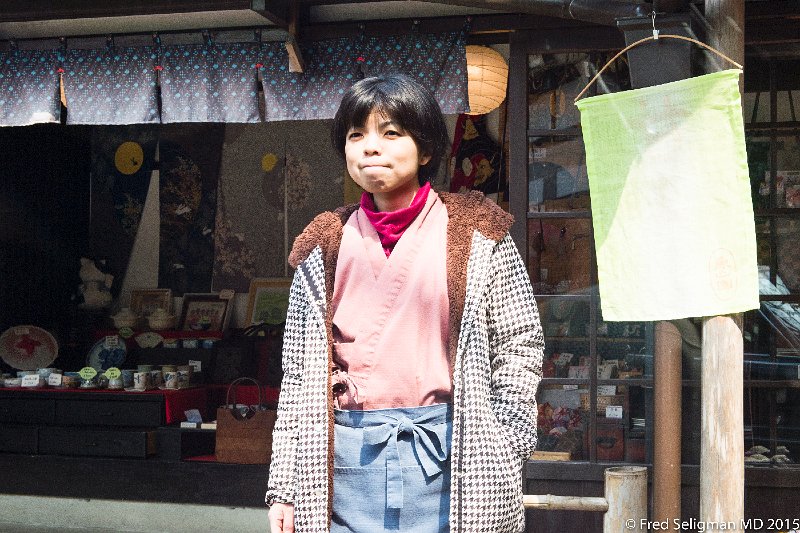 20150313_111229 D4S.jpg - Lady outside store on way to Sanzen-in Temple, Kyoto Prefecture await tourists